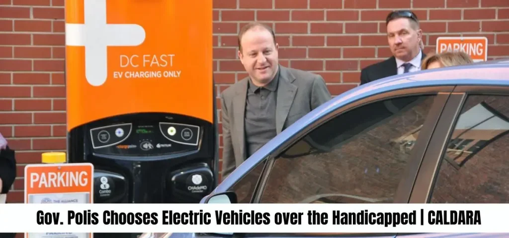 this is the image of Gov. Polis Chooses Electric Vehicles over the Handicapped | CALDARA
